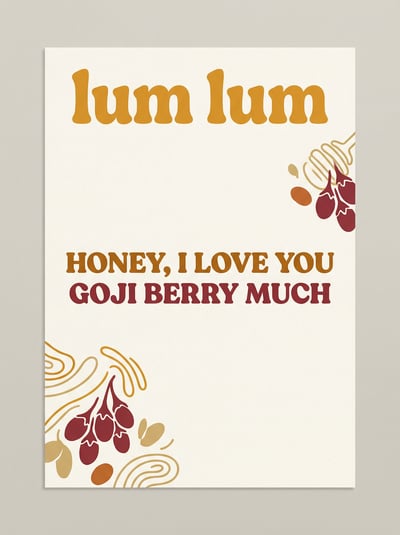 Granola packaging label with text Honey I Love You Goji Berry Much, yellow type, and botanical berry accents.